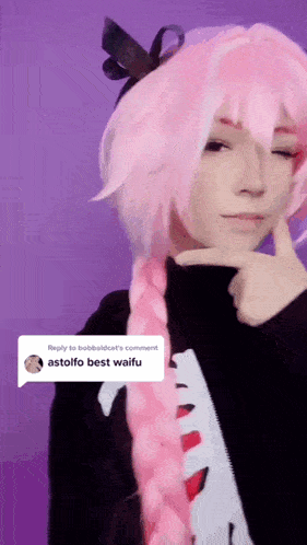 a girl with pink hair has a reply to bobbaldcat 's comment asking for the best waifu