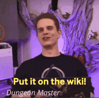 a man is holding up a sign that says put it on the wiki