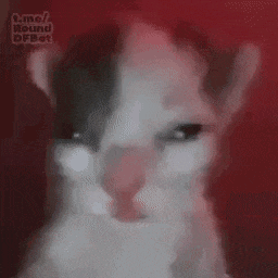 a close up of a person 's face with a red background and smoke coming out of it .