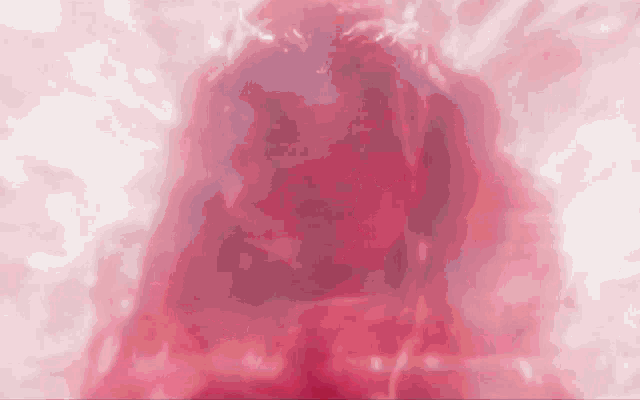 a red and white background with a blurred image of a person 's face