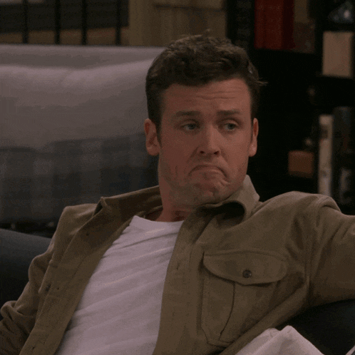 a man sitting on a couch says no