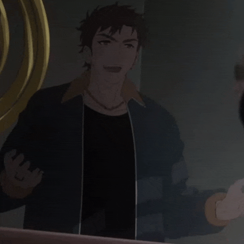 a man is standing in front of a mirror in a dark room holding a ring .