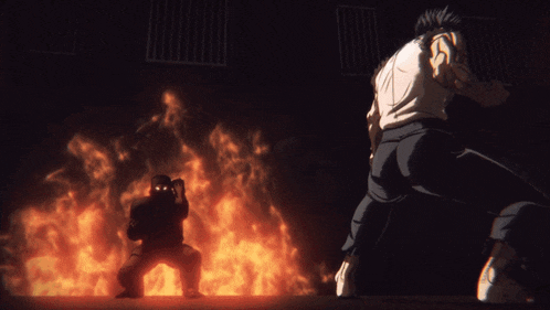 a man is standing in front of a fire