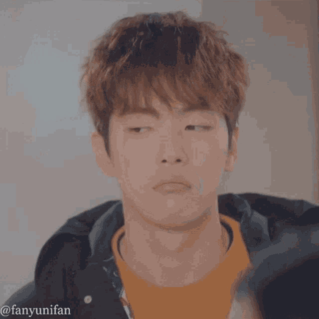 a close up of a young man 's face with the hashtag fanyunifan