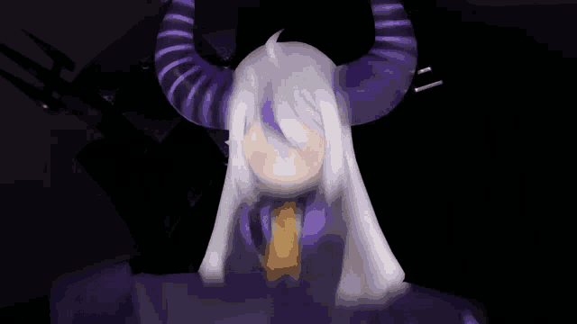 a cartoon character with purple horns and the letter n on her chest