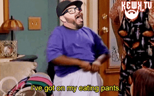 a man in a purple shirt says i ve got on my eating pants