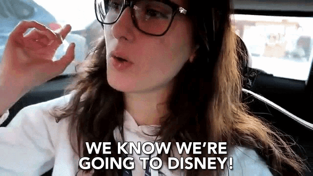 a woman wearing glasses is saying we know we 're going to disney