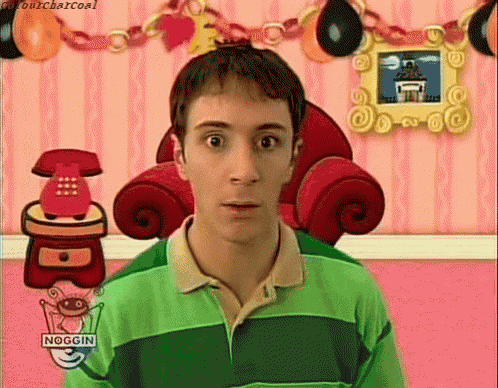 a man in a green shirt with the word noggin on the front