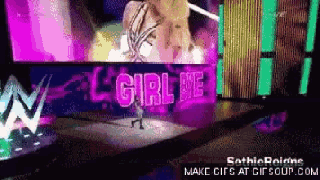 a girl is standing in front of a sign that says girl be