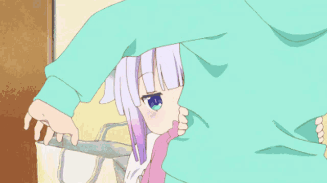 a little girl with horns and blue eyes is laying on a bed