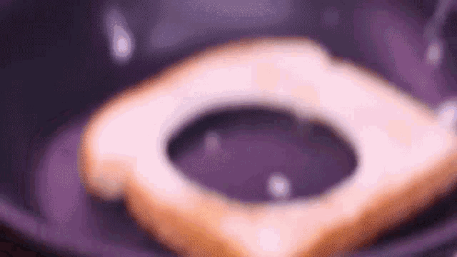 a close up of a piece of bread in a bowl .