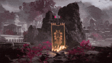 a green banner with a gold emblem on it is hanging from a rock