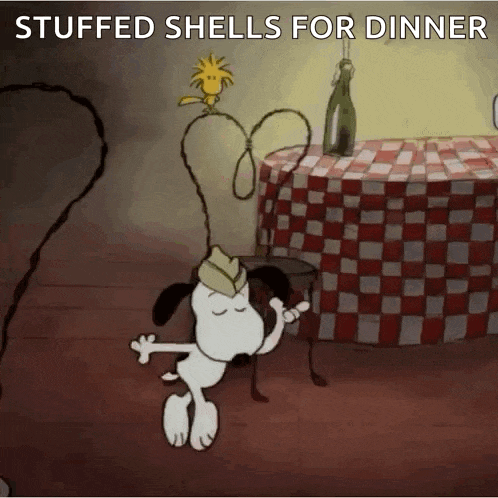 a cartoon of snoopy and woodstock dancing in front of a table with a checkered tablecloth .