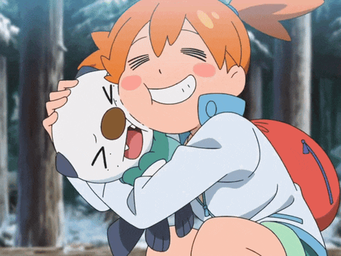 a girl is hugging a stuffed animal with the letter v on it