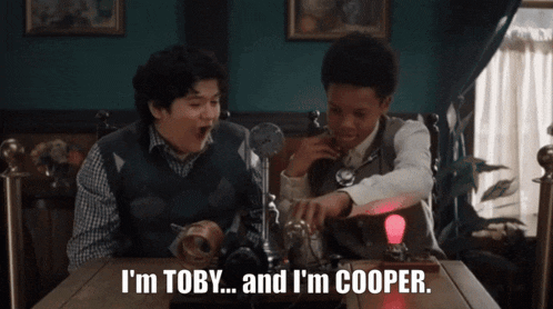 two boys sitting at a table with the words i 'm toby and i 'm cooper on the table
