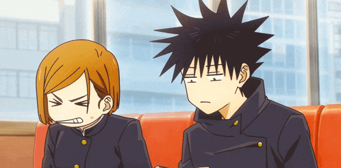 two anime characters are sitting on a red couch