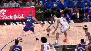 a basketball game is being played in front of a chick-fil-a banner