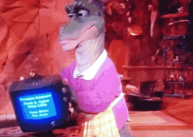 a dinosaur in a pink apron is holding a computer