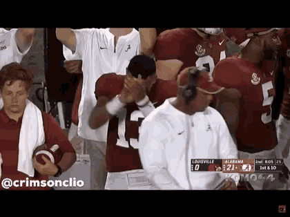 a football game is being played between the louisville and alabama teams