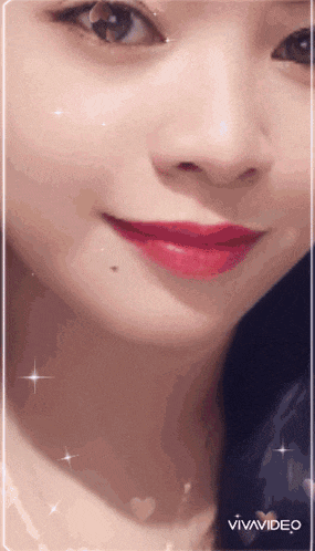 a close up of a woman 's face with red lipstick and vivavideo written on the bottom