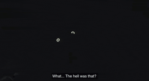 a cartoon character is laying on the floor in a dark room with a checkered floor .