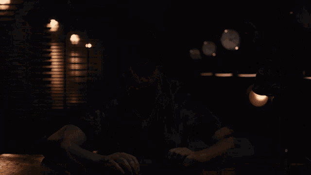 a man sitting at a table with his mouth open