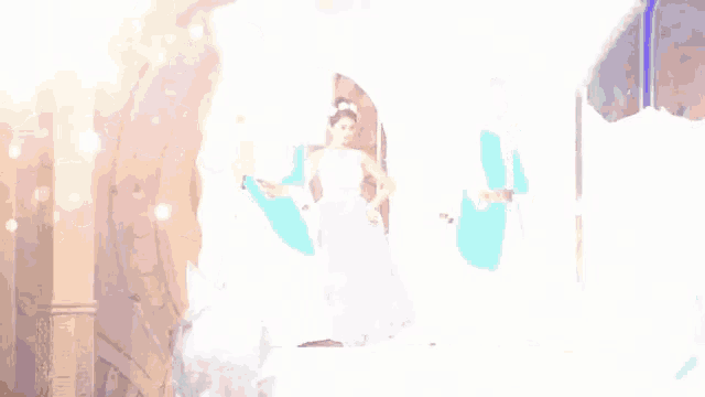 a woman in a pink dress is standing next to two men in white costume