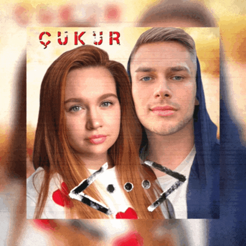 a man and a woman are on a poster that says ' ukur ' on it