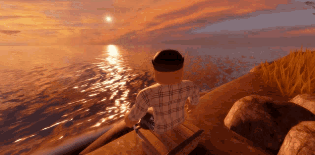 a man in a plaid shirt sits on a rock near the water