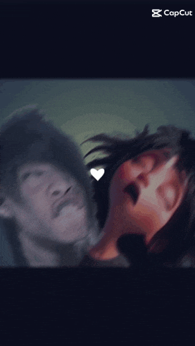 a blurry picture of a man and a woman with the caption capcut on the bottom
