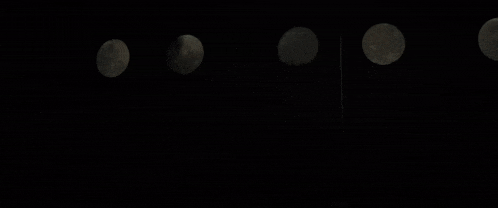 a silhouette of a person in a dark room with smoke coming out of the ceiling