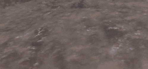 a robot with a shield and a gun is flying in the air