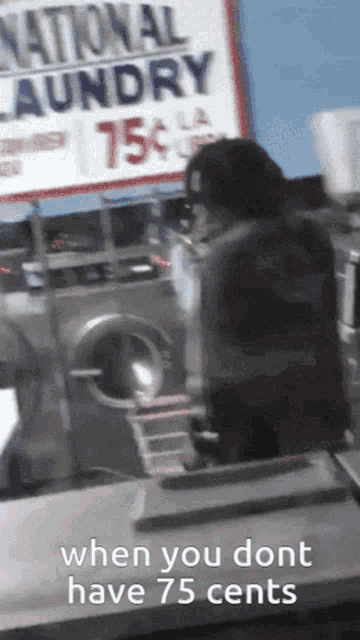 a laundromat with a sign that says national laundry for 75 cents