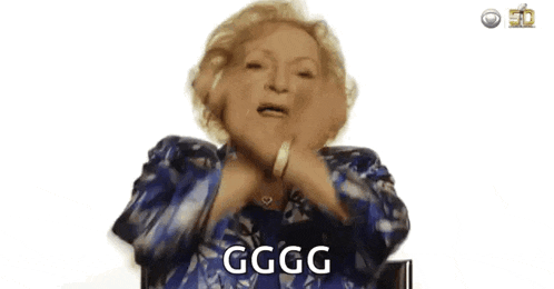 a woman in a blue jacket is making a funny face and saying gggg .