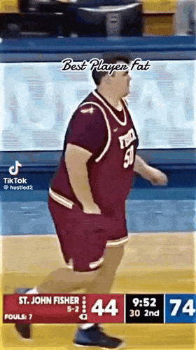 a man in a basketball uniform is running on a court .