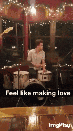 a man playing drums with the words feel like making love written below him