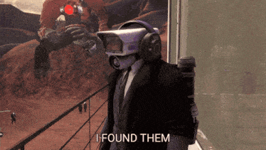 a man in a suit and tie with a camera on his head says i found them