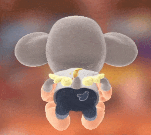 a stuffed animal with wings on its back and a banana on its butt