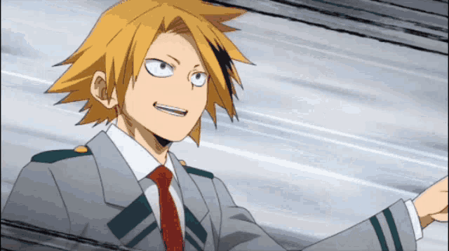 a man with yellow hair and a red tie