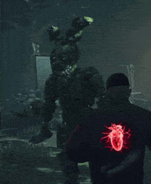 a man in a black jacket with a heart on the back