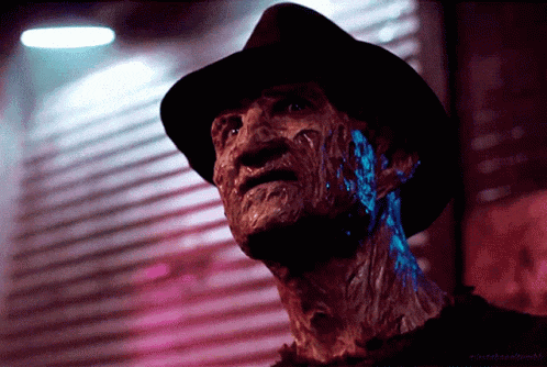 a close up of a nightmare before christmas freddy krueger with glowing face