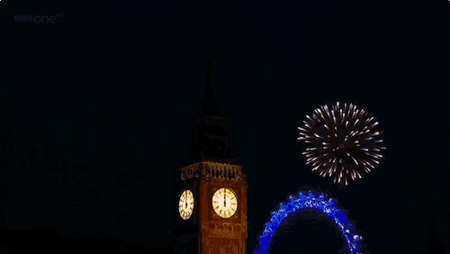 fireworks are displayed in front of the big ben clock tower and the london eye