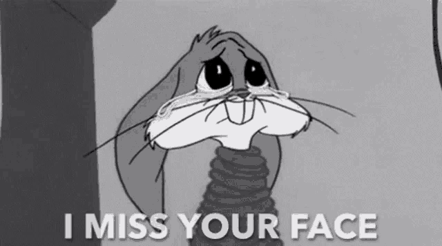 bugs bunny is crying in a black and white cartoon with the words `` i miss your face '' .