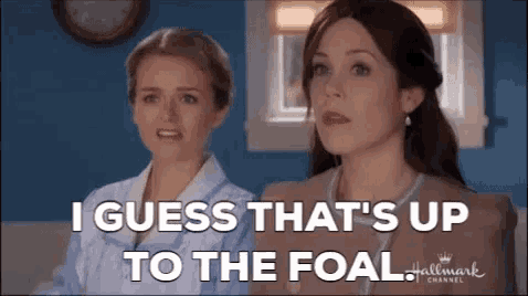 two women are standing next to each other and one of them is saying i guess that 's up to the foal .