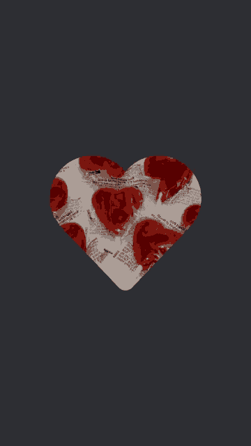 a heart shaped lollipop is covered in a newspaper