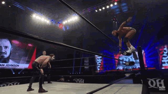 a wrestler named an johnson is jumping over the ropes