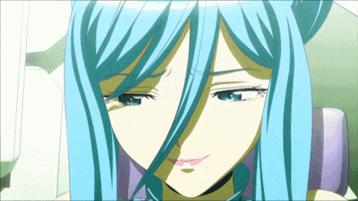 a close up of a girl with blue hair making a face