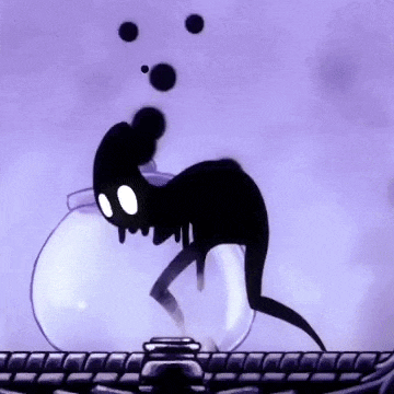 a cartoon character is sitting in a bowl of water .