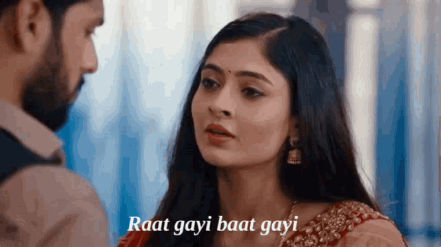 a man and a woman are looking at each other with the words " raat gayi baat gayi " on the bottom