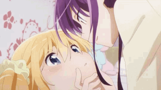 a couple of anime girls kissing each other on the cheek .
